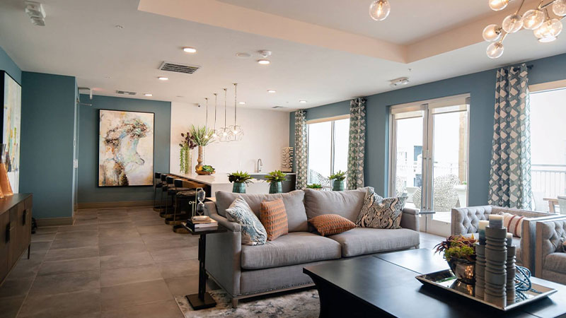 Projects black wooden coffee table near white couch